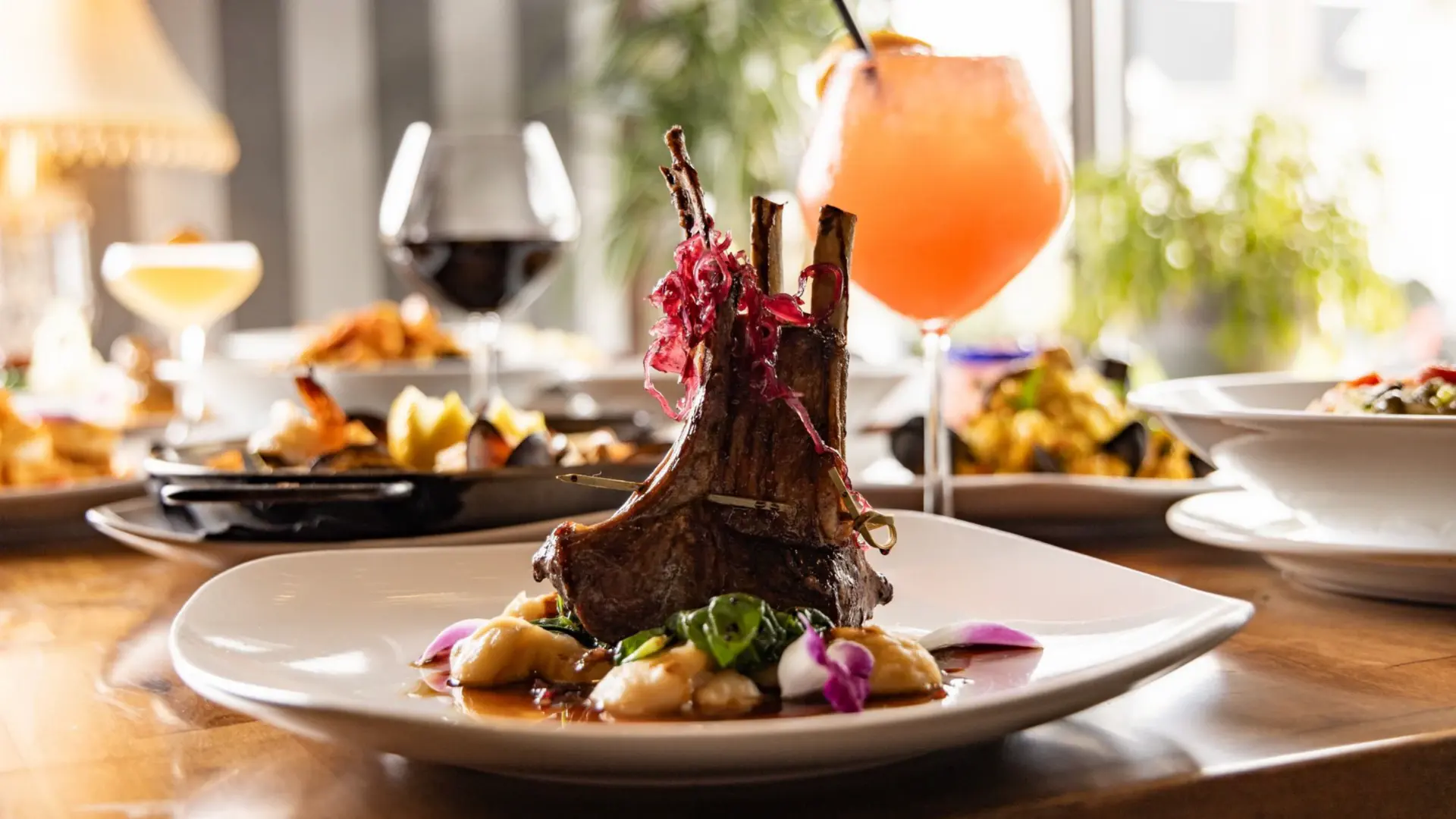Rack of lamb with gnocchi, spinach, and cocktails at The Manhattan